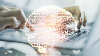 Double exposure of creative artificial Intelligence symbol with hands typing on laptop on background. Neural networks and machine learning concept